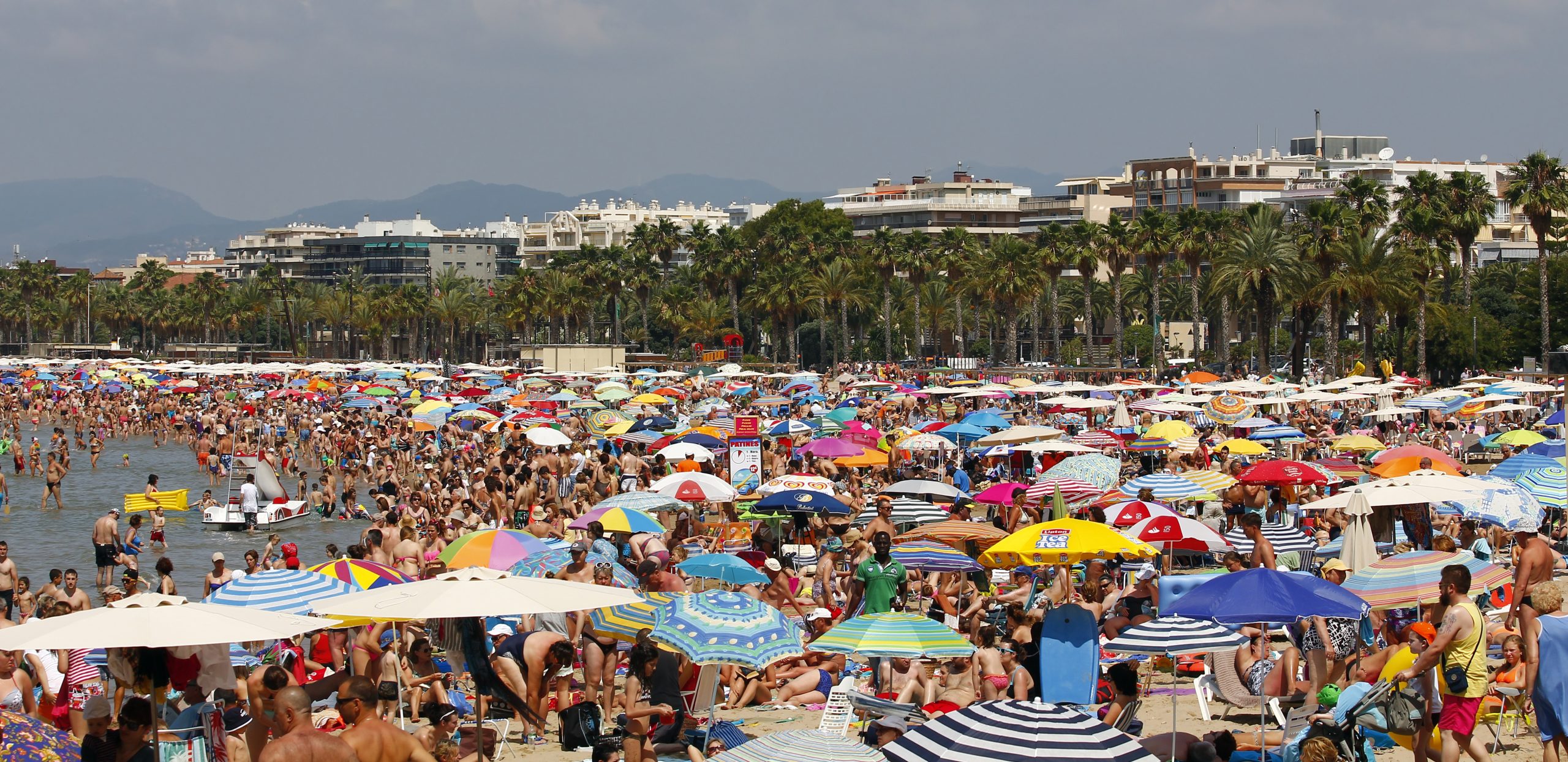 A crowded beach abroad in the height of summer