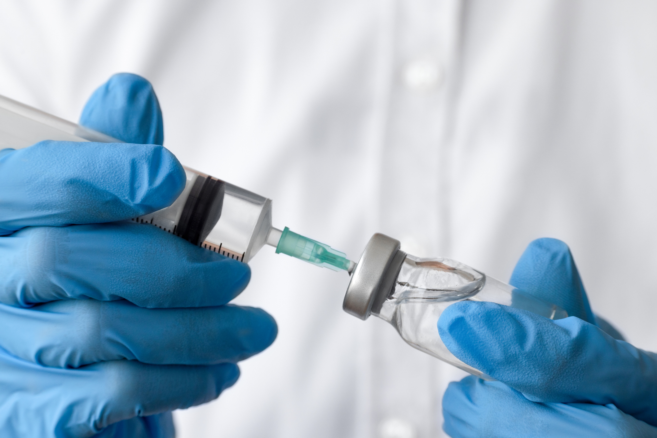 A doctor getting a vaccination ready