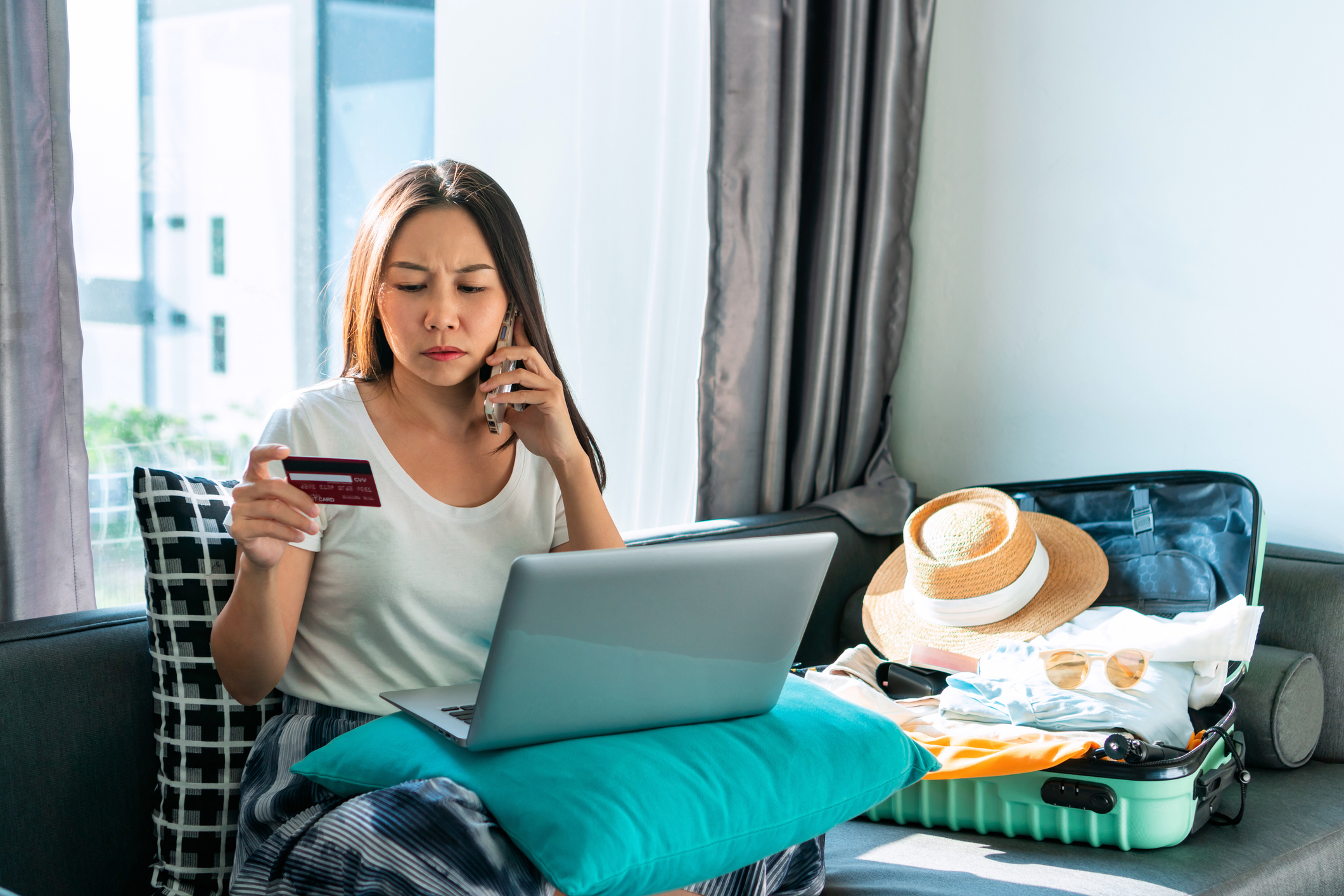 A woman realizing shes been the victim of travel fraud